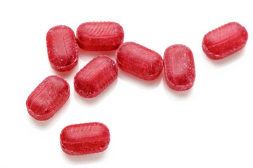 Fruit red candies isolated on white background 2