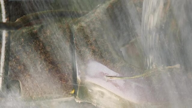 Close up of dirty gravel bike fork. Washing and cleaning bike. Vertical video