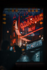 colorful neon in the night with silhouette of  person reflected  - obrazy, fototapety, plakaty