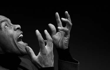 black man praying to god with hands together Caribbean man praying  wit people stock image stock...