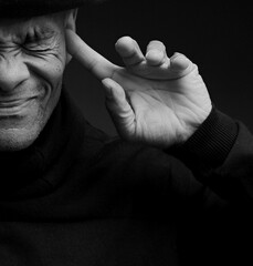 deaf man suffering from deafness and hearing loss on grey background with people stock photo	