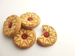 cookies with strawberry jam on a white background, close up