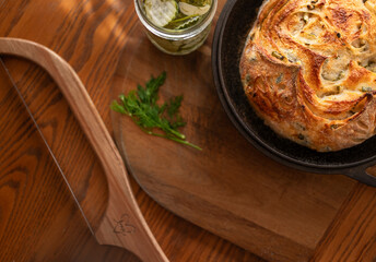 Baked sourdough bread stuffed with dill pickle and white cheddar cheese