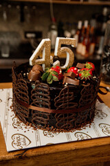 dark chocolate cake decorated with strawberries