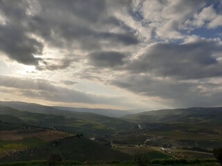 Fototapeta premium clouds over the mountains, countryside in Jordan 2022