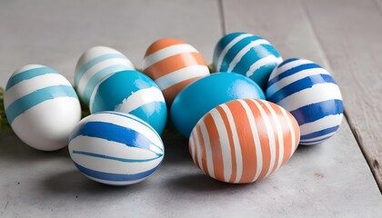 Fototapeta premium Blue and white stripes colored easter eggs in a wicker nest