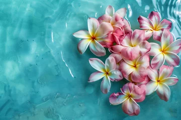 Deurstickers plumeria flowers in a shape of a heart in a shallow turquoise pool top view © AI for you