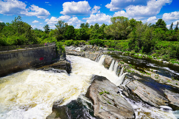 Roaring rapids of the Hogs back waterfall on the Rideau river at the Vincent Massey park in...