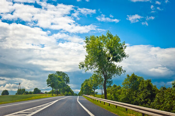 Road in a sunny day landscape - 760051697