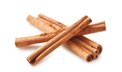 Cinnamon sticks with powder cinnamon isolated on white background .