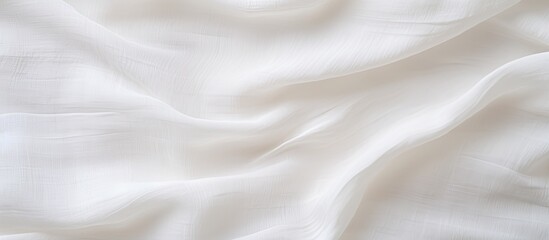 A detailed shot of a white cloth displaying wave patterns, resembling fur. The material is...