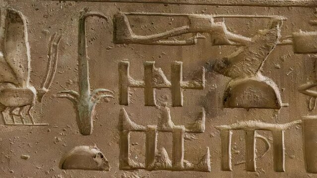 Mysterious hieroglyphics symbols on the ceiling beam in the temple of Seti I in Abydos. Egypt. Tank, Helicopter, Airplane and other vehicles. Egypt.