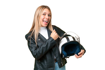 Young pretty blonde woman with a motorcycle helmet over isolated chroma key background celebrating a victory