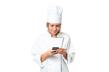 Young chef woman over isolated chroma key background sending a message with the mobile