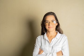 young latin business woman with glasses looking forward smiling conveying security and closeness