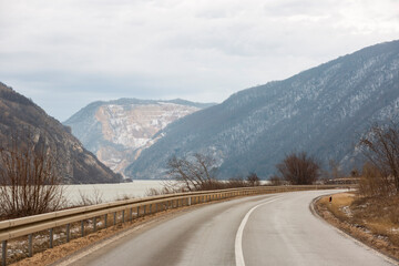 Fototapeta premium Incredibly beautiful mountain. Fantastic road with views of amazing mountains. River along the road with mountains