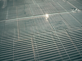 Power plant using renewable solar energy with sun. aerial view of solar panels