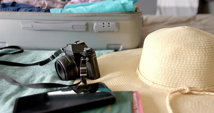 A suitcase lies open with travel essentials