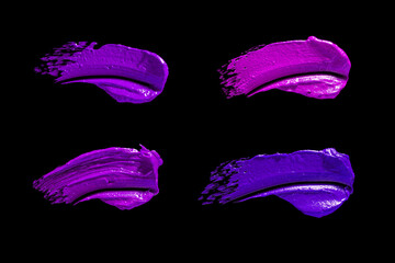 Blue pigment cosmetic creamy purple fuchsia tones isolated on black