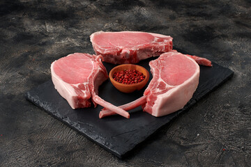 Raw fesh pork meat with bones on wooden board - 760105619