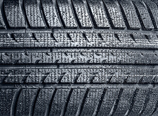 CLose up of car tire with drops - 760105670