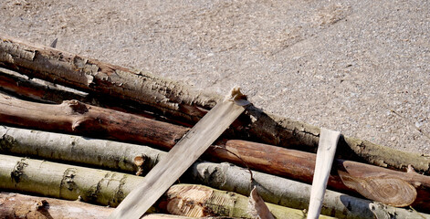 Raw wood poles held together by rope - 760109658