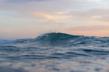 Fototapeta na wymiar A small wave in the ocean.