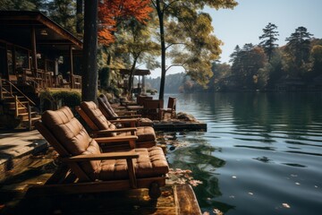 Chairs line the dock near the lake, overlooking the water and sky - obrazy, fototapety, plakaty