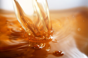 Close up of pouring golden liquid 