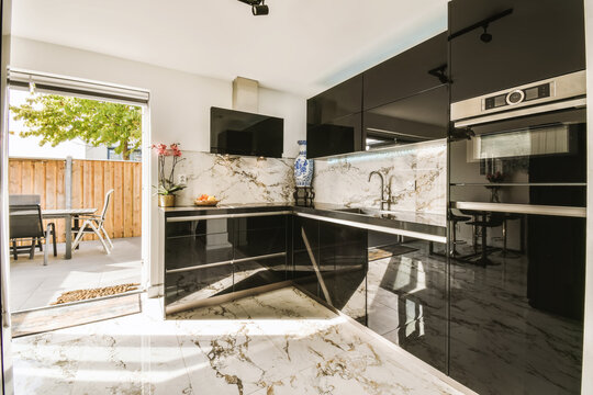 Modern Kitchen with Black Cabinets and Marble Design
