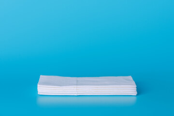 Paper handkerchiefs lie on a blue background - hygiene, runny nose, cleanliness, health care, allergies, symptoms