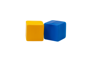 Multicoloured plastic cubes for children's games. Yellow and blue cubes are lying side by side. No background. One next to the other. Horizontally. High quality photo.