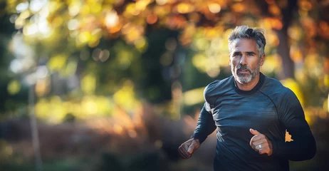 Foto op Aluminium An athletic middle-aged man jogging with a focus on healthy lifestyle choices © Studio Multiverse