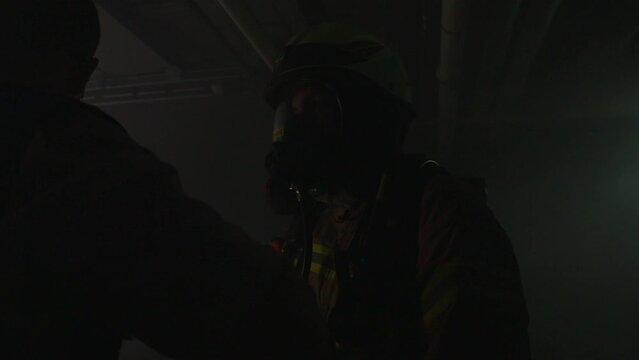 Firefighters. Rescue Mission in the smoke