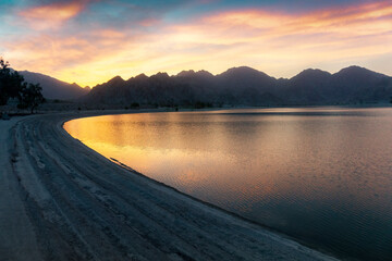 A beautiful sunset on the shore at lake Cahuilla, California.