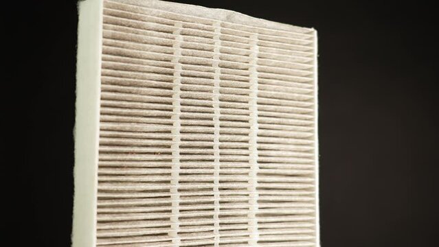 Replaceable HEPA air filter macro close up. Filter for air purification from fine dust and odours and other allergen air pollution. Helps breathing better by trapping pollutants in the air.
