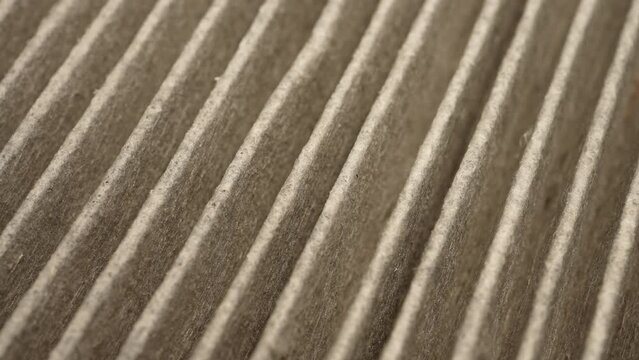 HEPA air filter to stop spread of dust particles floating in the air, dust grains with air pollution and prevent allergy. Macro slow motion view. High efficiency particulate air filter macro close up