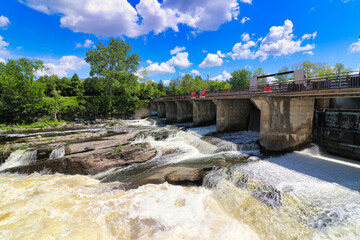 Roaring rapids of the Hogs back waterfall are formed from the dam on the Rideau river at the...