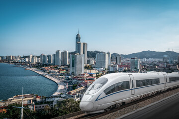 Sleek High-Speed Train Along Scenic Coastal City