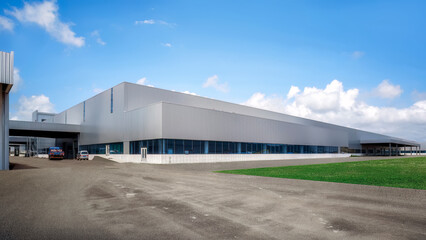 Fototapeta na wymiar Expansive Industrial Warehouse on Cloudy Day