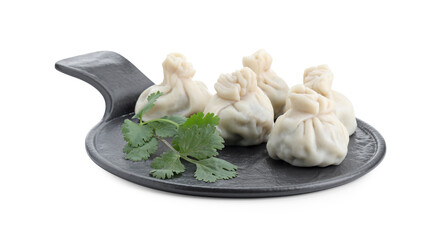 Serving board with tasty fresh khinkali (dumplings) and parsley isolated on white. Georgian cuisine