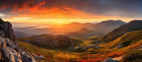 Majestic Mountain Range Silhouetted By Vibrant Sunset Sky Over Scenic Landscape