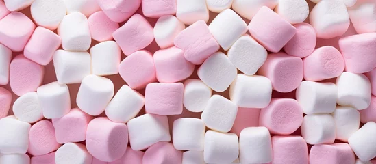 Poster Fluffy Pink and White Marshmallows Set Against a Dreamy Background © Ilgun