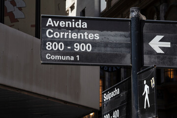 Signpost arrows with street names in the Buenos Aires city, Argentina.
