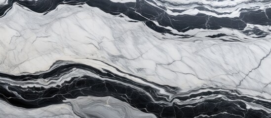 A close up of a black and white marble texture resembling a snowy mountain slope, with fluid patterns resembling a glacial landform - obrazy, fototapety, plakaty