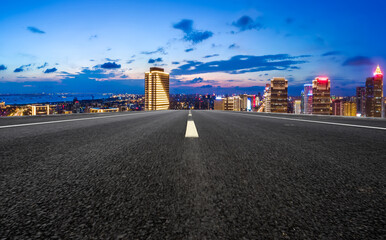 Twilight Cityscape from Empty Urban Road