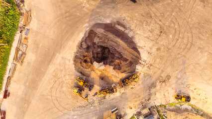 Aerial view yellow grader building a highway, Grader that is making roads and adjusting the area at...