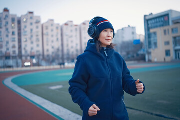 Woman Enjoying Morning Run with Headphones On