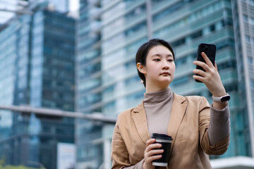 Professional Woman Checking Smartphone in City