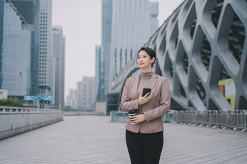 Professional Woman Walking in Urban Environment